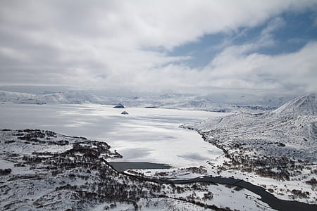 body of water near mountain alps thumbnail