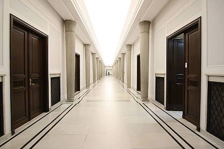 white painted wall between pathway thumbnail