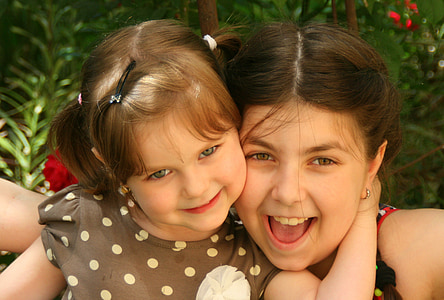 toddler touching girl's neck thumbnail