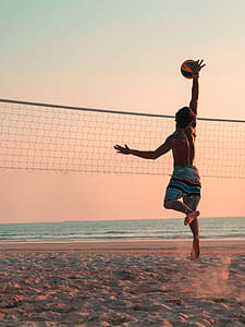 man playing beach volleyball thumbnail