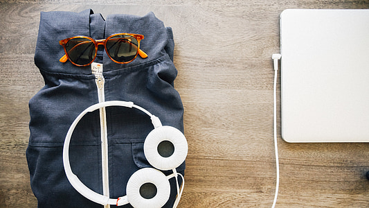 white corded headphones on black textile thumbnail