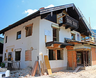 white concrete house under blue and white sky thumbnail