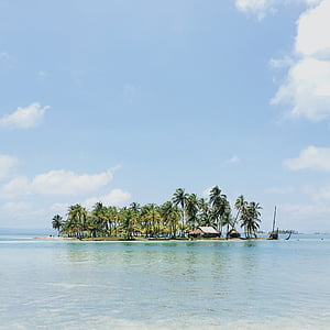 island and body of water under blue sky during daytime thumbnail
