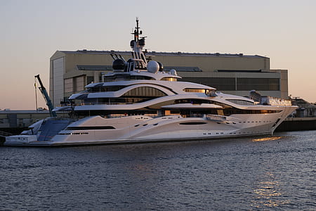 white crew ship beside dock at daytime thumbnail