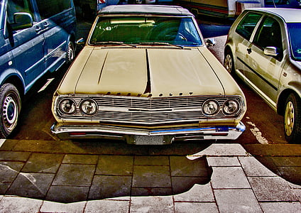 beige vehicle on gray concrete surface thumbnail