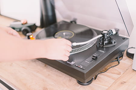 person playing turntable thumbnail