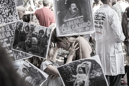 photo of woman and girl standing beside photos thumbnail