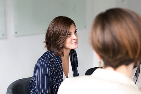 Woman Listening At Team Meeting Photo thumbnail