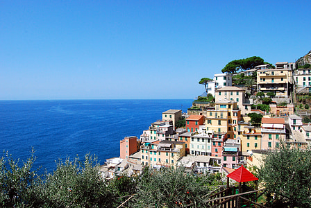 high-angle photography of village near body of water thumbnail