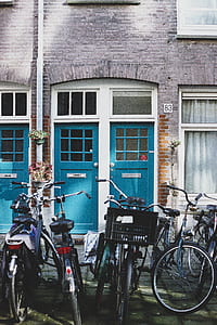 several bicycle in front of concrete building thumbnail