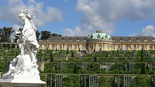 white statue near castle during daytime thumbnail