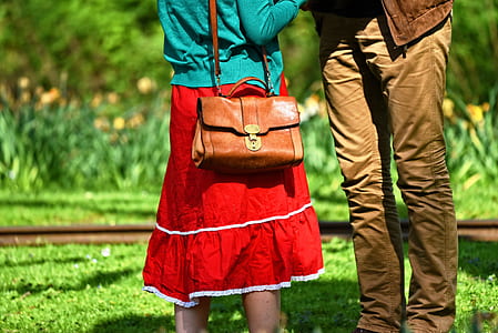 two persons standing on green grass thumbnail