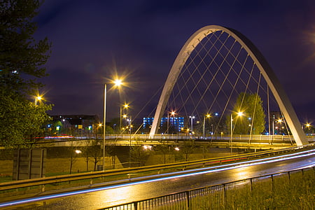photo of white arch beside road thumbnail
