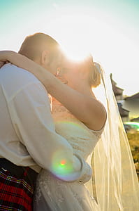 silhouette photography of smiling newly wedded couple hugging each other thumbnail