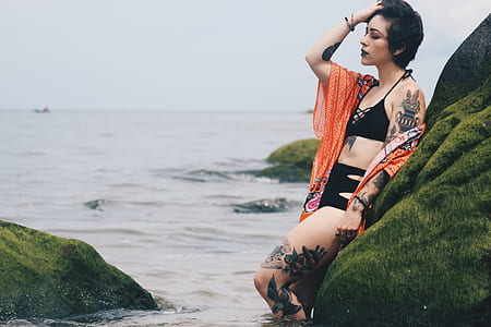 woman leaning on rock thumbnail