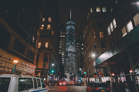 grey tower and building at nighttime thumbnail