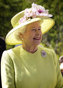 Queen Elizabeth II wearing yellow sun hat thumbnail