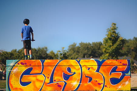 boy playing kick scooter thumbnail