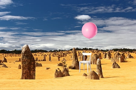 white chair with balloon on brown soil ground thumbnail