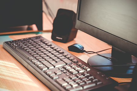 selective focus photography of black corded computer keyboard on desk thumbnail