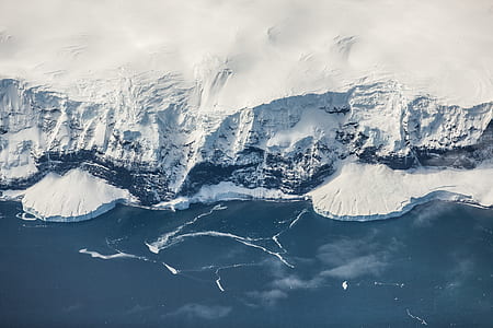 aerial view of snow covered land thumbnail
