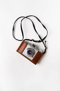 white and black DSLR camera thumbnail