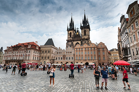 people standing and walking near building during daytime\ thumbnail