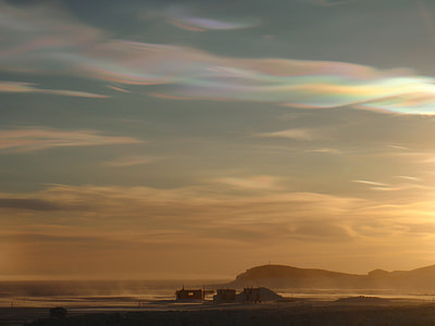 Orange skies and Nacreous Clouds at Hut Point, Antarctica thumbnail