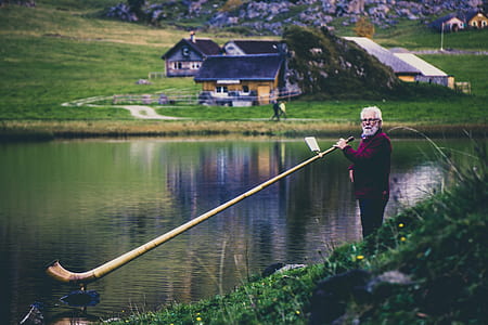 man holding horn thumbnail