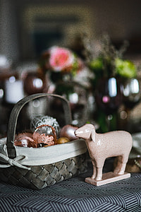 Round dinner table decorated with easter motifs thumbnail