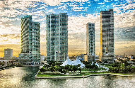 photo of high-rise building near body of water thumbnail