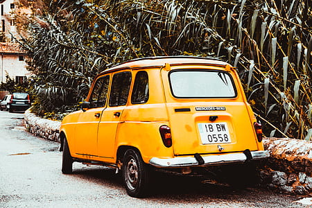 Classic Yellow Car on Side of Road at Day thumbnail