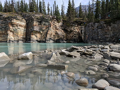 gray rock on body of water during daytime thumbnail