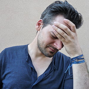 man wearing black henley-style shirt thumbnail