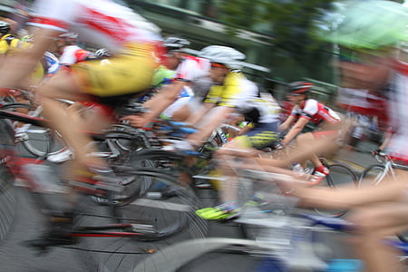 cyclist on road during daytime thumbnail