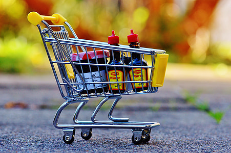 stainless steel shopping cart miniature with soy sauce bottles thumbnail