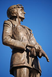 statue of man wearing gloves and helmet thumbnail