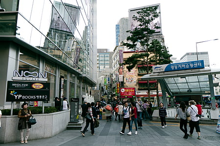 people gathered outside buildings at daytime thumbnail