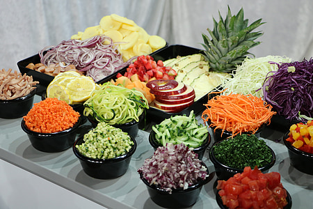 chops of vegetables and fruits in bowls and trays thumbnail