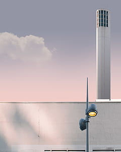 white tower building under blue sky thumbnail