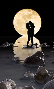 silhouette photo of man and woman with moon thumbnail