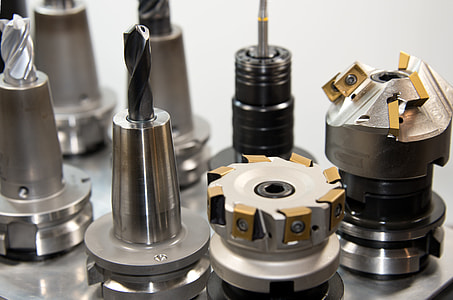 assorted-types of drill bits on grey surface thumbnail
