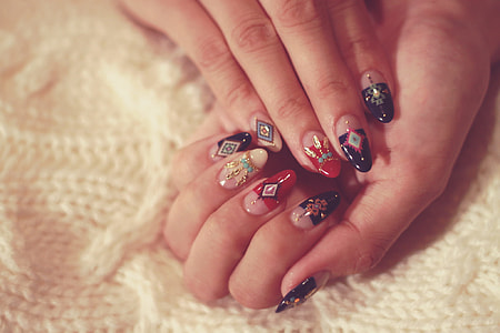 human's hand with nail polish thumbnail