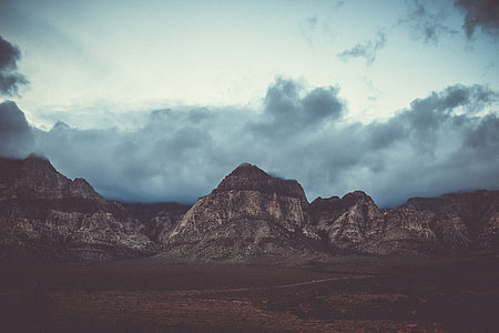 gray stone formation range under cloudy sky thumbnail