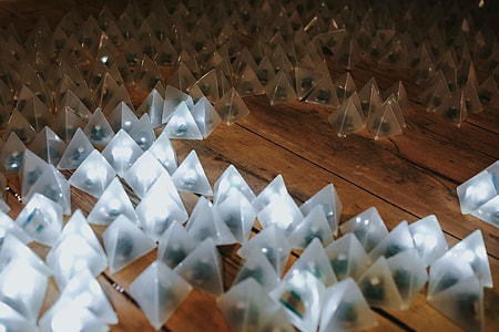 Little triangle lights on a wooden floor thumbnail