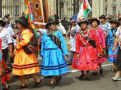 women in traditional dresses walking on street during daytime thumbnail
