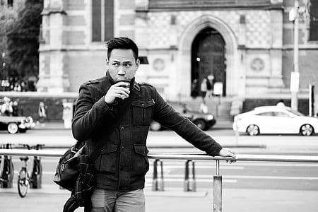 grayscale photo of man wearing jacket thumbnail
