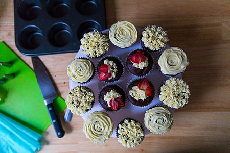 cupcakes on brown wooden surface thumbnail