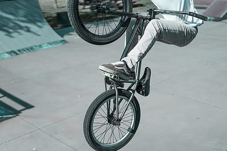 person riding on bicycle doing tricks thumbnail
