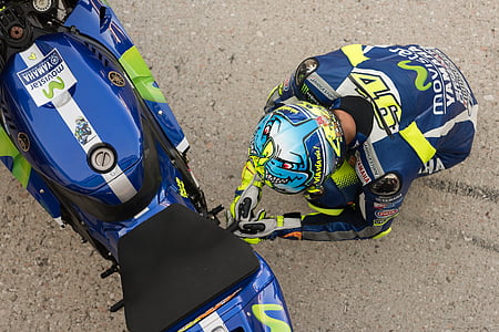 person sitting beside motorcycle thumbnail